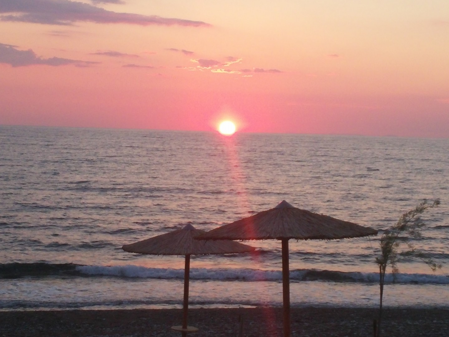 Sunset and beach at Irida Resort Suites